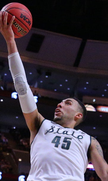 Valentine triple-double leads No. 13 Michigan St. over No. 4 Kansas